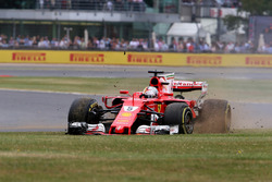Sebastian Vettel, Ferrari SF70H, with a front puncture