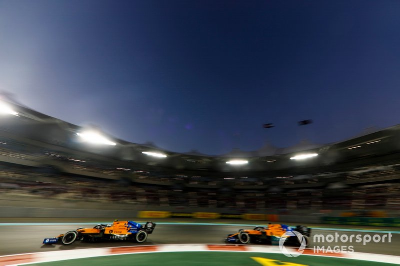 Lando Norris, McLaren MCL34, leads Carlos Sainz Jr., McLaren MCL34