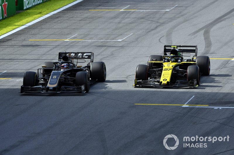 Romain Grosjean, Haas F1 Team VF-19, battles with Nico Hulkenberg, Renault F1 Team R.S. 19