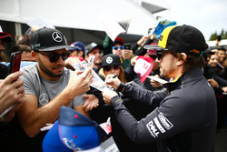Fernando Alonso, McLaren, signs autographs for fans