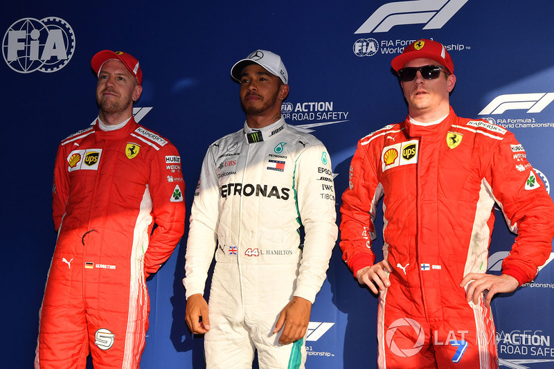 Sebastian Vettel, Ferrari, pole sitter Lewis Hamilton, Mercedes-AMG F1 and Kimi Raikkonen, Ferrari in parc ferme