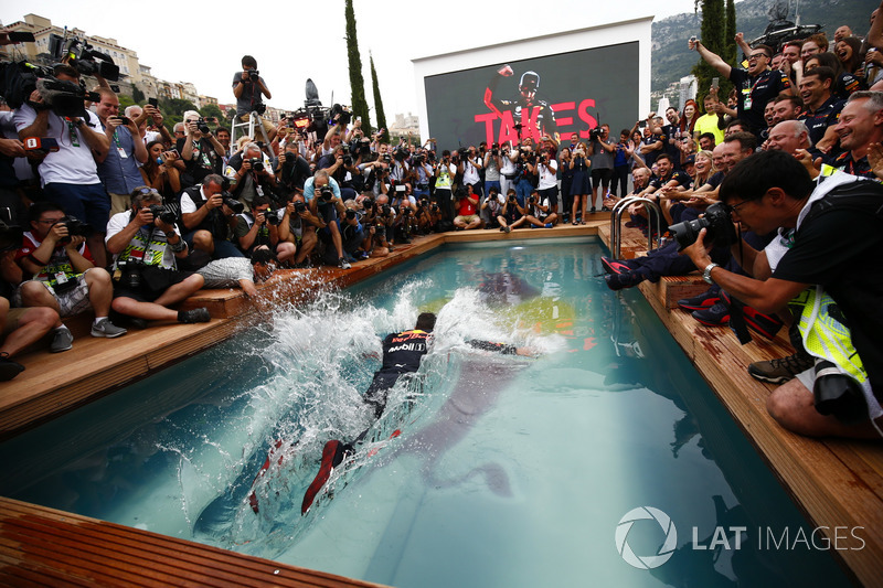 Daniel Ricciardo, Red Bull Racing, dives into the swimming pool on the Red Bull Energy Station