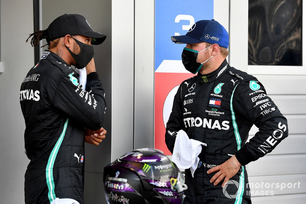 Pole man Lewis Hamilton, Mercedes-AMG F1, and Valtteri Bottas, Mercedes-AMG F1, talk in Parc Ferme