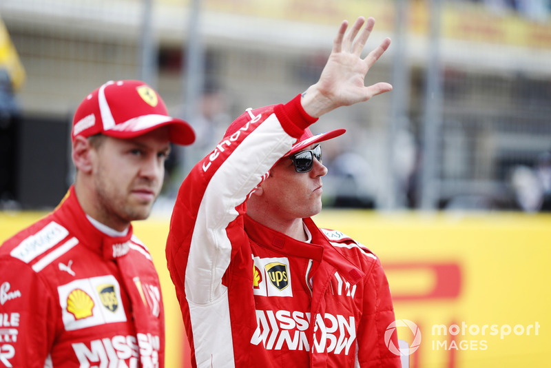 Sebastian Vettel, Ferrari, and Kimi Raikkonen, Ferrari, wave to the fans.