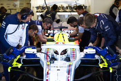 Engineers make adjustments to the car of Lance Stroll, Williams FW41