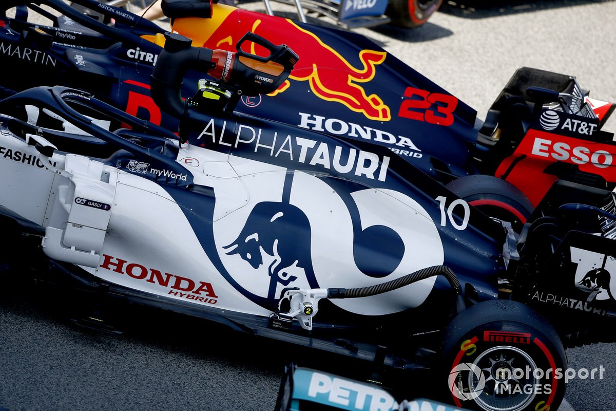 The cars of Pierre Gasly, AlphaTauri AT01, and Alex Albon, Red Bull Racing RB16, in Parc Ferme