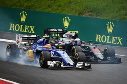 Felipe Nasr, Sauber C35 and Jenson Button, McLaren MP4-31 battle for position