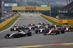 Lewis Hamilton, Mercedes AMG F1 W08, Sebastian Vettel, Ferrari SF70H, lead the pack in to the first corner