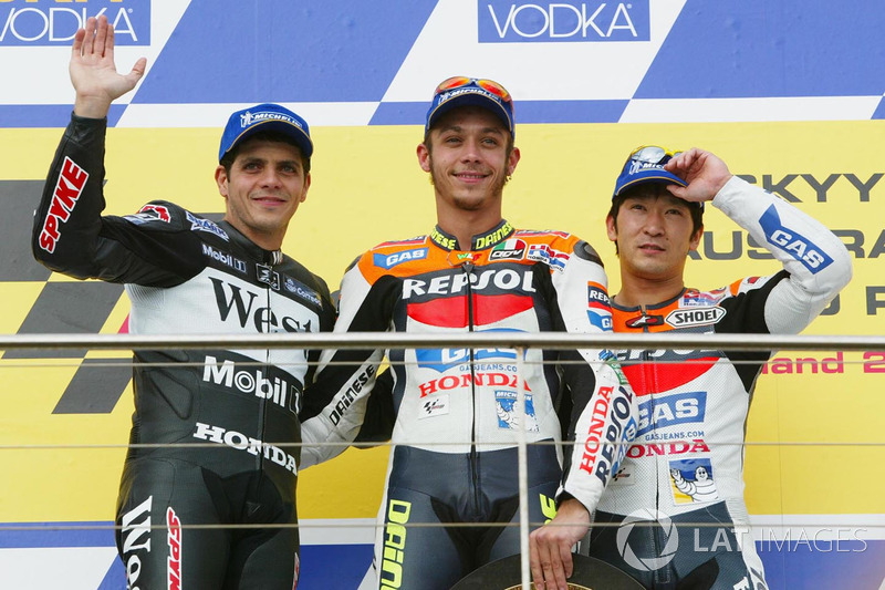 <img src="http://cdn-1.motorsport.com/static/custom/car-thumbs/MOTOGP_2017/RIDERS_NUMBERS/Rossi.png" width="55" /> #24 GP d'Australia 2002
