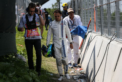 Race retiree Felipe Massa, Williams walks back after after crashing out of the race