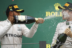 Lewis Hamilton, Mercedes AMG F1 sprays champagne over team-mate Nico Rosberg, Mercedes AMG F1 on the podium
