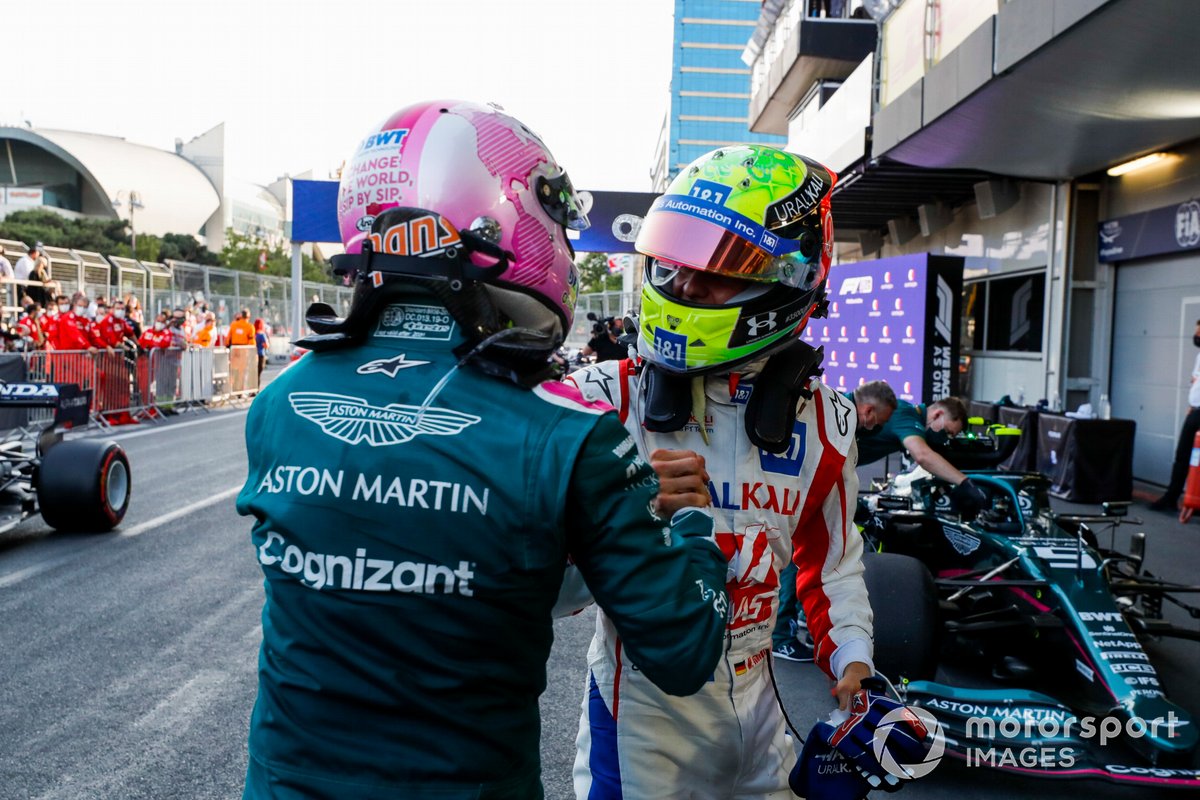 Mick Schumacher, Haas F1, congratulates Sebastian Vettel, Aston Martin, 2nd position, in Parc Ferme