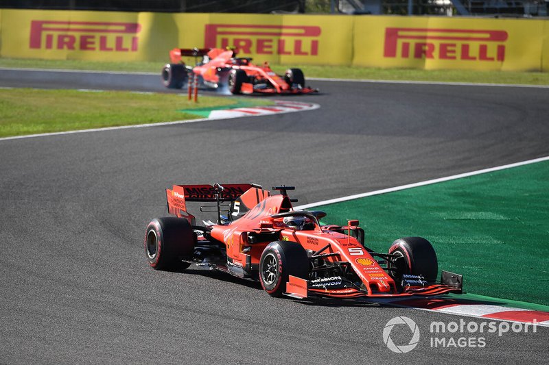 Sebastian Vettel, Ferrari SF90, leads Charles Leclerc, Ferrari SF90