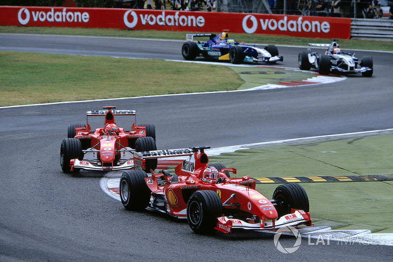 Rubens Barrichello, Ferrari F2004 leads team mate Michael Schumacher, Ferrari F2004