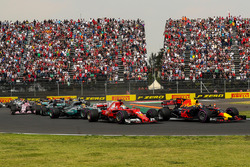 Max Verstappen, Red Bull Racing RB13 leads at the start of the race and collides with Sebastian Vett