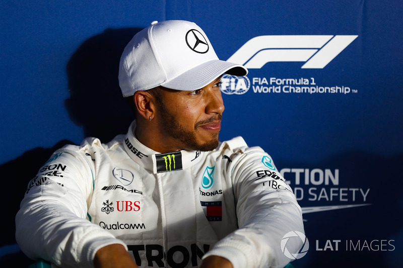 Lewis Hamilton, Mercedes AMG F1, relaxes after setting pole position