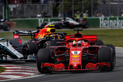 Sebastian Vettel, Ferrari SF71H, leads Valtteri Bottas, Mercedes AMG F1 W09, and Max Verstappen, Red