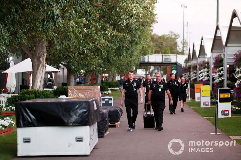 AlphaTauri Honda staff in the paddock amongst packing crates