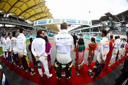 Fernando Alonso, McLaren, Nico Hulkenberg, Renault Sport F1 Team, Daniel Ricciardo, Red Bull Racing, the rest of the drivers stand for theMalaysian national anthem