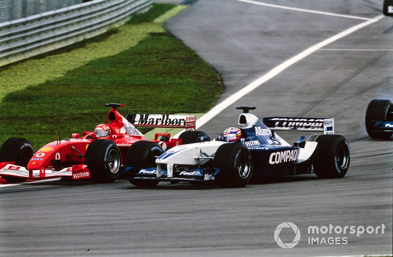Michael Schumacher, Ferrari F2001, battles with Juan Pablo Montoya, Williams FW24 BMW