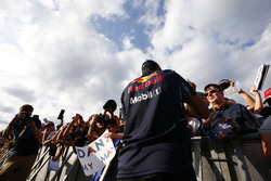 Daniel Ricciardo, Red Bull Racing, signs autographs for fans