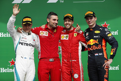 Sebastian Vettel, Ferrari, celebrates on the podium with Valtteri Bottas, Mercedes AMG F1 and Max Ve