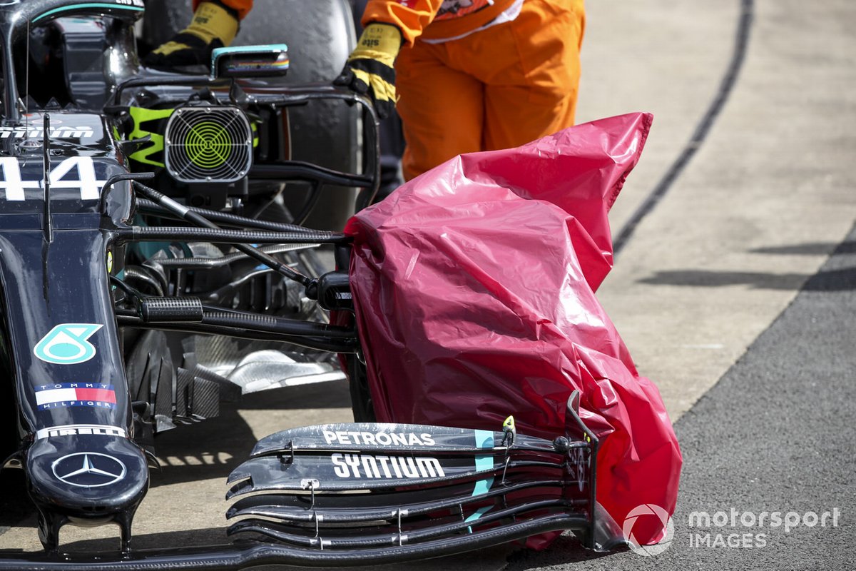 Damaged tyre on the car of Lewis Hamilton, Mercedes F1 W11 covered with a bag