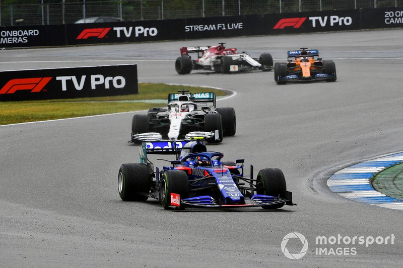 Alexander Albon, Toro Rosso STR14, leads Lewis Hamilton, Mercedes AMG F1 W10, and Carlos Sainz Jr., McLaren MCL34