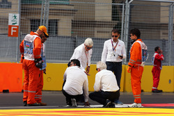 Charlie Whiting, FIA Delegate and Herbie Blash, FIA Delegate inspect the circuit after GP2 qualifying is postponed