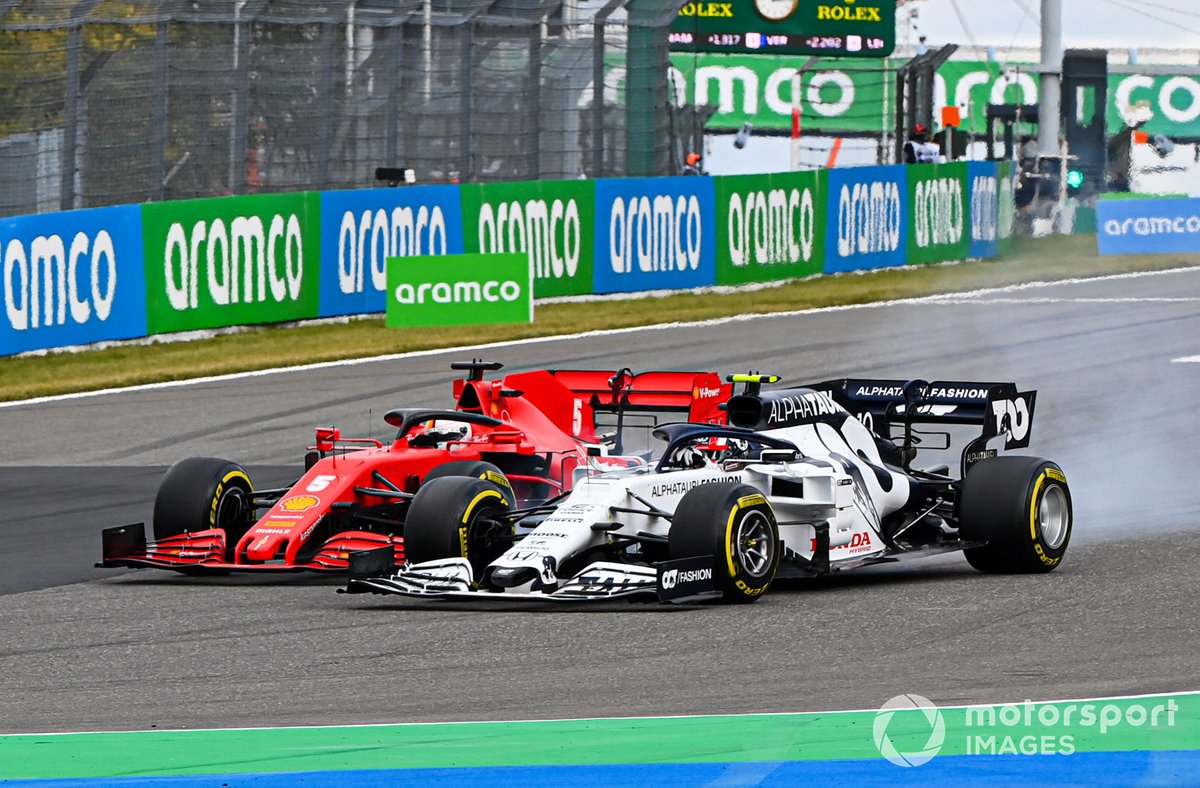Pierre Gasly, AlphaTauri AT01, battles with Sebastian Vettel, Ferrari SF1000