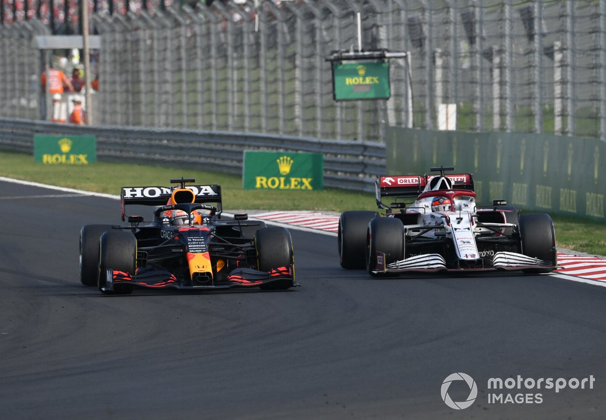 Max Verstappen, Red Bull Racing RB16B, passes Kimi Raikkonen, Alfa Romeo Racing C41
