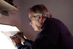 Giorgio Piola works on a drawing