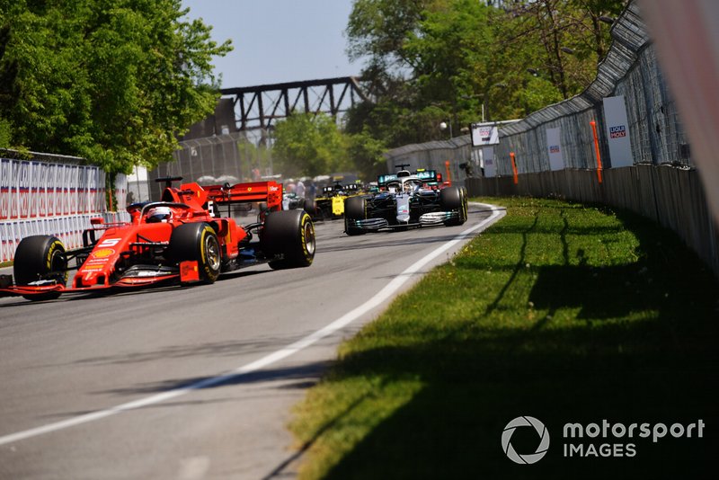 Sebastian Vettel, Ferrari SF90, leads Lewis Hamilton, Mercedes AMG F1 W10, Charles Leclerc, Ferrari SF90, Daniel Ricciardo, Renault R.S.19, Pierre Gasly, Red Bull Racing RB15, and Nico Hulkenberg, Renault R.S. 19, at the start