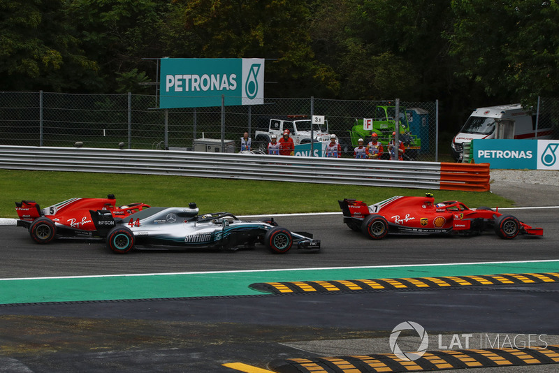 Sebastian Vettel, Ferrari SF71H making contact with Lewis Hamilton, Mercedes AMG F1 W09 and Kimi Raikkonen, Ferrari SF71H leads the race