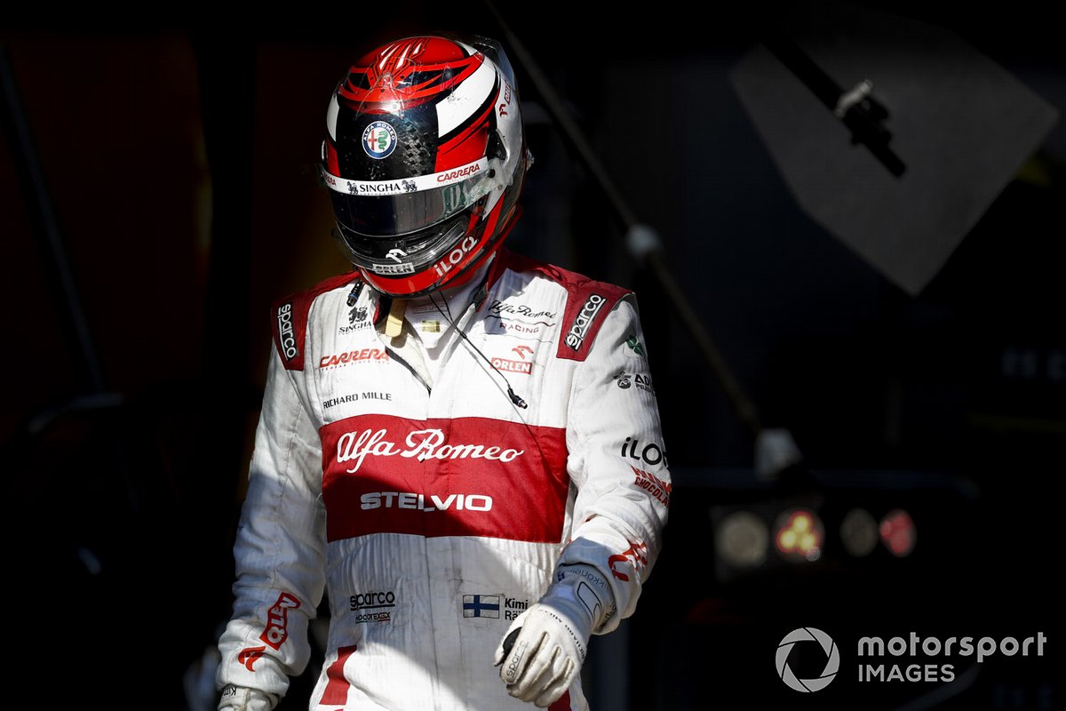 Kimi Raikkonen, Alfa Romeo, walks back to his garage after retiring from the race