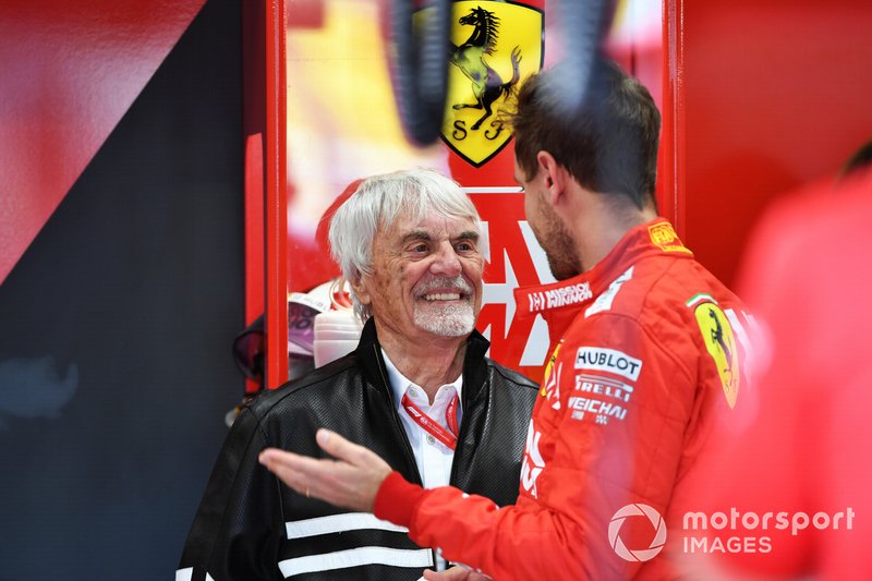 Bernie Ecclestone, Chairman Emiritus of Formula 1, in the Ferrari garage with Sebastian Vettel, Ferrari