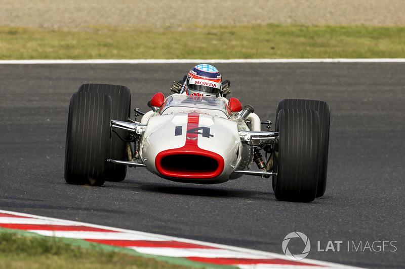 Takuma Sato drives a Honda RA300