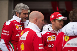 (L to R): Maurizio Arrivabene, Ferrari Team Principal with Jock Clear, Ferrari Engineering Director and Sebastian Vettel, Ferrari