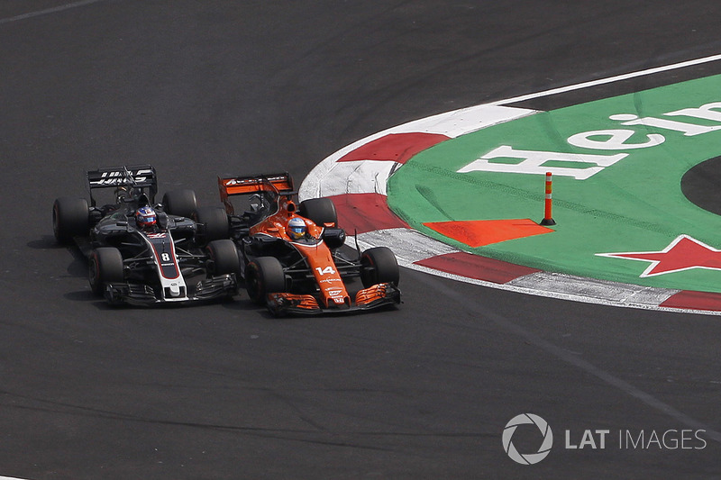 Fernando Alonso, McLaren MCL32 and Romain Grosjean, Haas F1 Team VF-17 battle