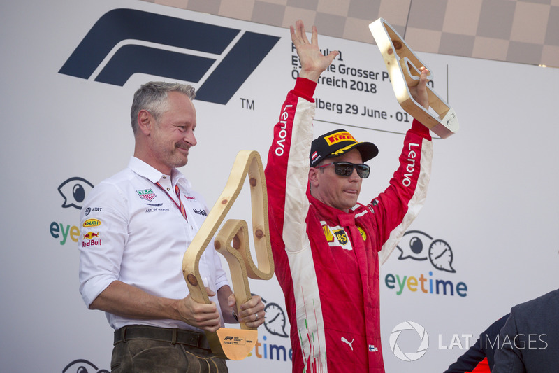 Jonathan Wheatley, Red Bull Racing Team Manager and Kimi Raikkonen, Ferrari celebrate on the podium