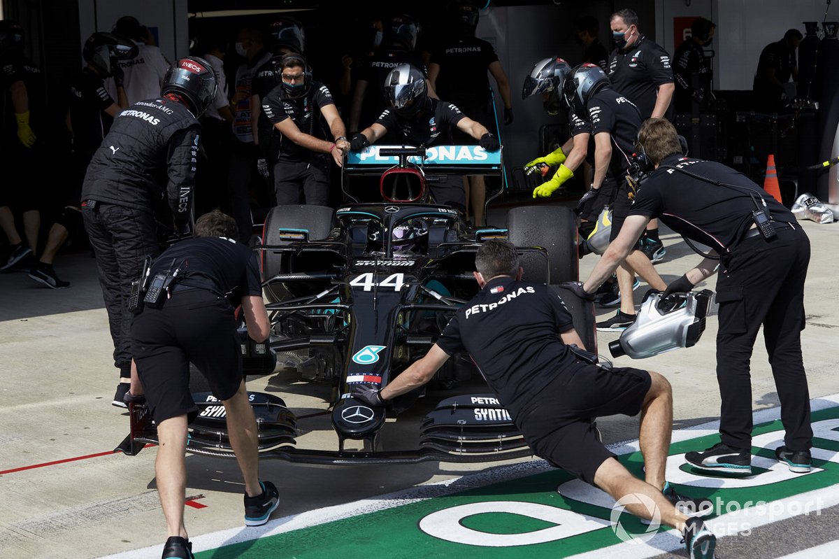 Lewis Hamilton, Mercedes F1 W11, is returned to the garage