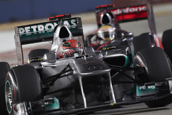 Michael Schumacher, Mercedes MGP W02; Lewis Hamilton, McLaren MP4-26