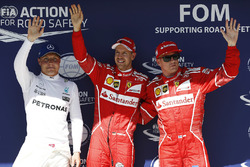 Il poleman Sebastian Vettel, Ferrari, il secondo qualificato Kimi Raikkonen, Ferrari, il terzo quali