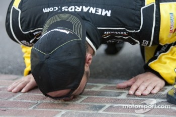 Victory lane: race winner Paul Menard, Richard Childress Racing Chevrolet celebrates with his team by kissing the yard of bricks