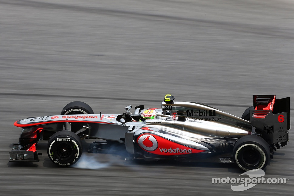 Sergio Perez, McLaren MP4-28 locks up under braking