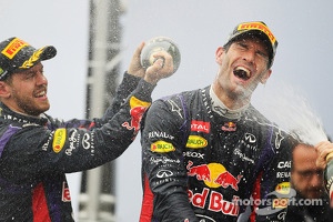 Mark Webber, Red Bull Racing celebrates his second position and final GP on the podium with team mate Sebastian Vettel, Red Bull Racing