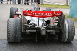 Lewis Hamilton's, McLaren Mercedes parked at the side of the track with badly worn tyres