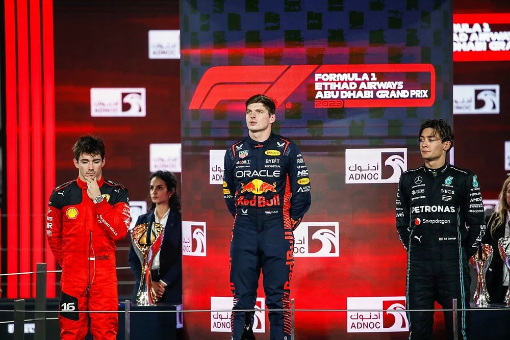 Charles Leclerc, Scuderia Ferrari, 2nd position, Max Verstappen, Red Bull Racing, 1st position, George Russell, Mercedes-AMG, 3rd position, during the podium ceremony