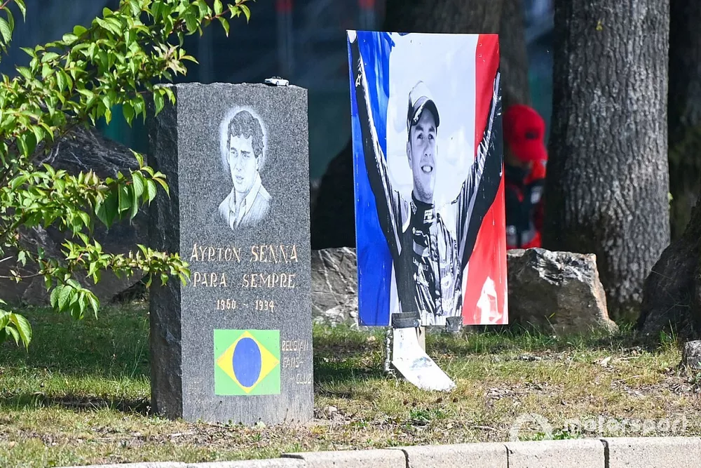 A tribute for Anthoine Hubert, alongside a plaque in memory of Ayrton Senna