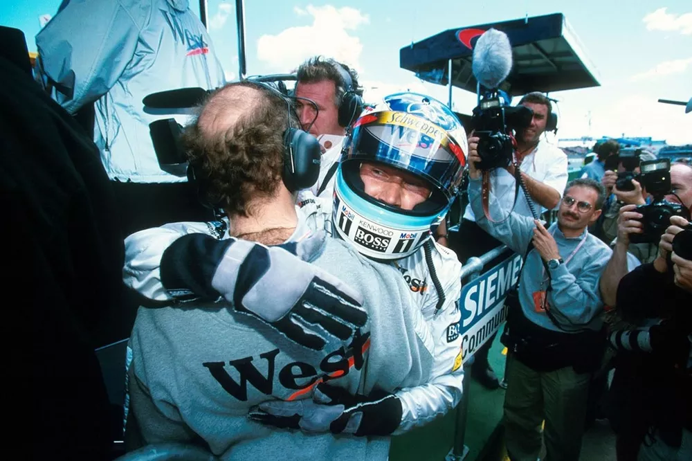 f1-australian-gp-1998-race-winner-mika-hakkinen-mclaren-celebrates-victory-by-embracing-ad